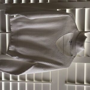 Long sleeved turtleneck sweater with teardrop front